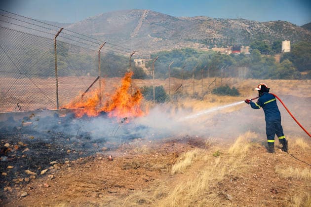Wildfire in Greece s Megara region MEGARA, GREECE - AUGUST 3: Firefighters operate on the ground as a wildfire continues to burn for a third consecutive day in the Megara region, west of Athens, Greece on August 3, 2026. Emergency services are working to contain the blaze amid challenging weather conditions across the area. Aris Oikonomou Anadolu Megara Greece. Editorial use only. Please get in touch for any other usage.  Copyright: x2026xAnadoluxArisxOikonomoux