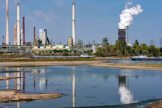 Extremely low water levels—here at the Thyssenkrupp Steel plant in Duisburg-Marxloh—have caused sandbars to form due to the low water level of the Rhine; cargo ships can only sail with reduced cargo; the TKS steel mill has cut back production because not enough raw materials can be d