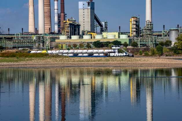 Extremely low water levels—here at the Thyssenkrupp Steel plant in Duisburg-Marxloh—have caused sandbars to form due to the low water level of the Rhine; cargo ships can only sail with reduced cargo; the TKS steel mill has cut back production because not enough raw materials can be d