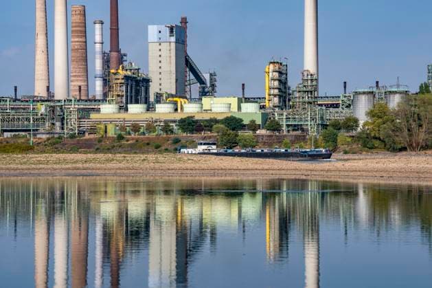 Extremely low water levels—here at the Thyssenkrupp Steel plant in Duisburg-Marxloh—have caused sandbars to form due to the low water level of the Rhine; cargo ships can only sail with reduced cargo; the TKS steel mill has cut back production because not enough raw materials can be d