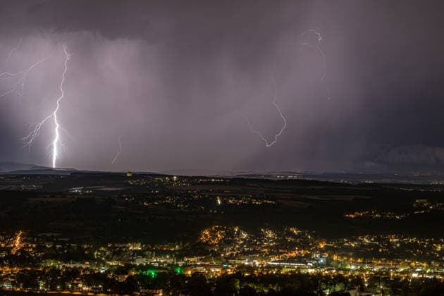 Lightning strike over the Rhine Valley near Bad Godesberg and Wachtberg; view from Petersberg in the Siebengebirge range looking west; a bolt of lightning strikes near a thunderstorm front; in the foreground, the Rhine and the towns of Bonn, Mehlem, Bad Godesberg, and Wachtberg; clearly visible is the radome of the Fraunhofer Ins Copyright: xMarcxJohnx