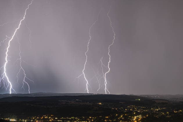 Lightning striking over the Rhine Valley near Bad Godesberg and Wachtberg; view from Petersberg in the Siebengebirge range looking west; several bolts of lightning strike as a thunderstorm front passes; in the foreground: Bonn-Mehlem, Bad Godesberg, and Wachtberg; Königswinter, North Rhine-Westphalia, Germany Copyright: xMarcxJohnx