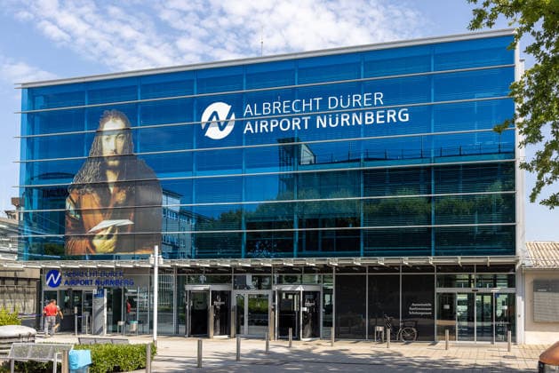 Construction Begins on Cargo Center 3 at Nuremberg Airport, Nuremberg, August 4, 2026 The terminal building at Albrecht Dürer Airport Nuremberg features a large-scale portrait of Albrecht Dürer on its facade. The airport is expanding its cargo area and beginning construction of the new Cargo Center 3 (CCN 3), to meet the consist 20260804-286A4222-M4000