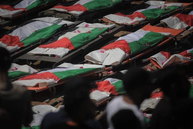 Palestinians Hold Mass Funeral for 112 Members of Two Families in Gaza GAZA CITY, PALESTINE August 4, 2026: Palestinians carry the remains of 112 members of the Al-Hassaina and Abu Sharia families during a mass funeral procession in the Al-Sabra neighborhood of Gaza City on August 4, 2026. The victims were killed in separate Israeli attacks during the war that began on October 7, 2023, and their bodies were recovered from beneath the rubble months later. According to local authorities, the procession was among the largest funeral processions held in the Gaza Strip since the beginning of the war. Gaza Palestine, State of Copyright: x xMohammedxMxSkaikx xJNAxPressx