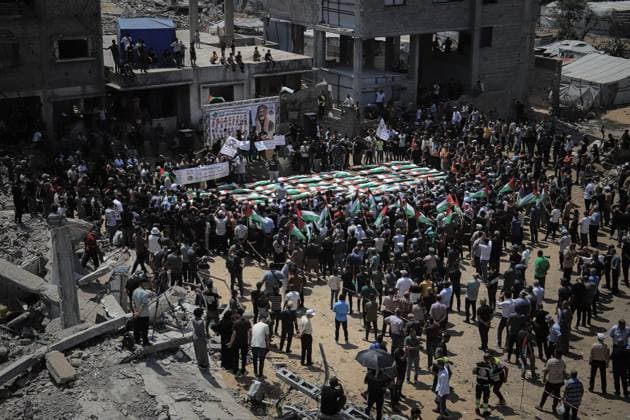 Palestinians Hold Mass Funeral for 112 Members of Two Families in Gaza GAZA CITY, PALESTINE August 4, 2026: Palestinians carry the remains of 112 members of the Al-Hassaina and Abu Sharia families during a mass funeral procession in the Al-Sabra neighborhood of Gaza City on August 4, 2026. The victims were killed in separate Israeli attacks during the war that began on October 7, 2023, and their bodies were recovered from beneath the rubble months later. According to local authorities, the procession was among the largest funeral processions held in the Gaza Strip since the beginning of the war. Gaza Palestine, State of Copyright: x xMohammedxMxSkaikx xJNAxPressx