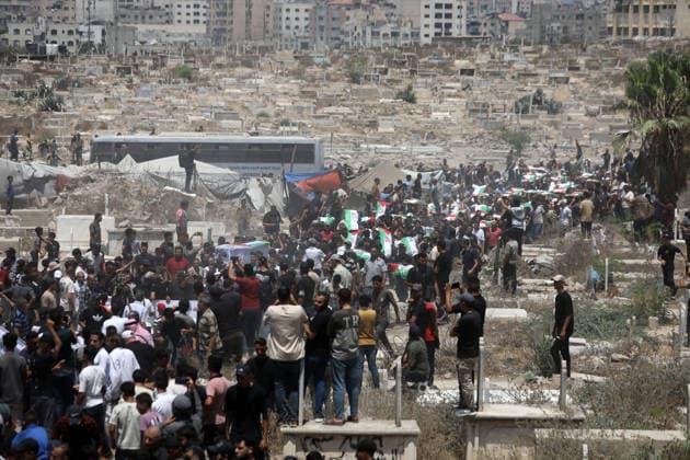 Mass funeral held for recovered remains in Gaza City s Sabra neighborhood Palestinians take part in a mass funeral for the recovered remains of members of the Abu Sharia and Al-Hasayna families in the Sabra neighborhood of Gaza City on August 4, 2026. The remains were recently recovered from beneath the rubble of their homes, which were destroyed in an Israeli strike earlier in the war. Gaza s Civil Defense said its crews recovered the remains of 112 people during a two-week operation in the residential area where the two families lived, which it said was hit in an Israeli airstrike on November 23, 2023. The Civil Defense estimates that more than 9,000 people remain missing or buried beneath the rubble of destroyed buildings across the Gaza Copyright: xapaimagesxBilalxOsamax xapaimagesx