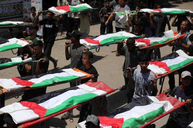 Mass funeral held for recovered remains in Gaza City s Sabra neighborhood Palestinians take part in a mass funeral for the recovered remains of members of the Abu Sharia and Al-Hasayna families in the Sabra neighborhood of Gaza City on August 4, 2026. The remains were recently recovered from beneath the rubble of their homes, which were destroyed in an Israeli strike earlier in the war. Gaza s Civil Defense said its crews recovered the remains of 112 people during a two-week operation in the residential area where the two families lived, which it said was hit in an Israeli airstrike on November 23, 2023. The Civil Defense estimates that more than 9,000 people remain missing or buried beneath the rubble of destroyed buildings across the Gaza Copyright: xapaimagesxBilalxOsamax xapaimagesx
