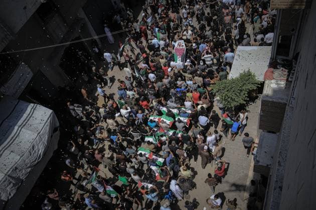 August 4, 2026, Gaza, Palestine, State of: GAZA Gaza, PALESTINE †August 4, 2026: Palestinians carry the remains of 112 members of the Al-Hassaina and Abu Sharia families during a mass funeral procession in the Al-Sabra neighborhood of Gaza City on August 4, 2026. The victims were killed in separate Israeli attacks during the war that began on October 7, 2023, and their bodies were recovered from beneath the rubble months later. According to local authorities, the procession was among the largest funeral processions held in the Gaza Strip since the beginning of the war. Gaza Palestine, State of - ZUMAq101 20260804_zna_q101_011 Copyright: xMohammedxMxSkaikx