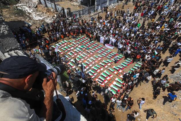 August 4, 2026, Gaza, Palestine, State of: GAZA Gaza, PALESTINIAN TERRITORIES †AUGUST 4, 2026: Palestinians attend the funeral of 112 members of the Hassayna and Abu Sharia families, who were killed in an Israeli strike in 2023 and whose remains were recently recovered from beneath the rubble, according to Gaza s Civil Defense, in Gaza City on August 4, 2026. Gaza Palestine, State of - ZUMAq101 20260804_zna_q101_023 Copyright: xRamezxHabboubx