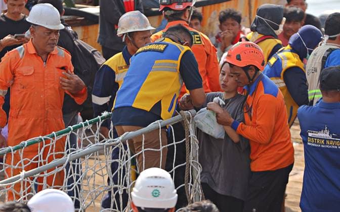 August 4, 2026, Surabaya, Indonesia: SURABAYA, EAST JAVA, INDONESIA †AUGUST 4, 2026: Survivors of the KM Mutiara Sentosa II ferry fire arrive at Tanjung Perak Port aboard the KM Masalembo in Surabaya, East Java, Indonesia, on August 4, 2026. Survivors described a chaotic evacuation, saying passengers received little or no guidance from the crew, searched for life jackets on their own, and some jumped into the sea before drifting for hours until they were rescued. Their accounts contrast with information provided by the ferry operator to the Indonesian National Search and Rescue Agency (BASARNAS), which stated that all 238 passengers were wearing life jackets during the evacuation. According to BASARNAS, 233 people survived and five - ZUMAq101 20260804_zna_q101_090 Copyright: xAndrexYurisx