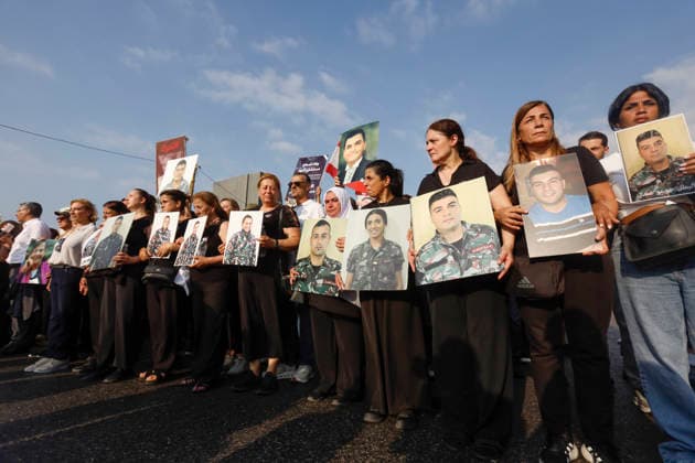 August 4, 2026, Beirut, Beirut, lebanon: Families of victims of the 2020 Beirut Port explosion take part in a central memorial march marking the sixth anniversary of the disaster in Beirut, Lebanon, on August 4, 2026. The march begins at the Beirut Fire Brigade while a second procession starts from Martyrs Square, with both converging near the Emigrant Statue facing the Beirut Port. Participants carry portraits of their relatives who were killed in the massive explosion as they continue to demand truth and justice Beirut lebanon - ZUMAb339 20260804_znp_b339_011 Copyright: xAbdulxKaderxAlxBayx