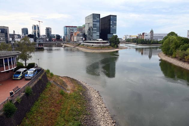 Record-low water levels on the Rhine; the Düsseldorf Water Police report that the Rhine’s water level in Düsseldorf has reached 23 cm—the lowest ever recorded there. A view of the entrance to the harbor basins; on the left is the Water Police station, and in the background is the Hyatt Regency Hotel, Düsseldorf, August 4, 2026