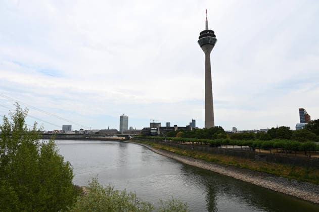 Historically low water levels on the Rhine; the Düsseldorf Water Police report that the Rhine’s water level in Düsseldorf has reached 23 cm—the lowest ever recorded there—view toward the Old Town, with the Rhine Tower in the background, Düsseldorf, August 4, 2026