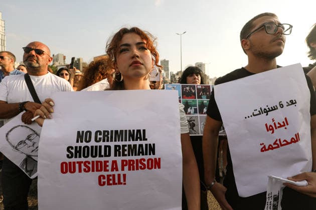 August 4, 2026, Beirut, Beirut, Lebanon: Activists hold banners demanding justice and accountability during a ceremony to mark the six anniversary of the massive explosion that killed more than 200 people and injuring more than 6,500 others. Lebanese authorities have said the explosion was triggered by a fire in a warehouse where tones of ammonium nitrate fertilizer had been stored haphazardly for years, despite repeated warnings to senior officials. Beirut Lebanon  - ZUMAn313 20260804_zip_n313_002 Copyright: xMarwanxNaamanix