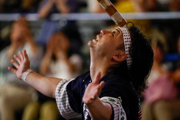 August 5, 2026, Akita, Japan: A participant balances a bamboo pole adorned with paper lanterns (kanto) on his forehead during the Akita Kanto Festival in Akita City. The annual event is one of the Tohoku region s three great festivals, where street performers skillfully balance over 270 towering bamboo poles (with the largest measuring 12 meters and weighing 50 kilograms) adorned with up to 46 candle-lit paper lanterns on their hands, shoulders, and foreheads to the rhythmic chant of dokkoisho. The festival runs from August 3 to 6. Akita Japan  - ZUMAm191 20260805_aap_m191_024 Copyright: xRodrigoxReyesxMarinx