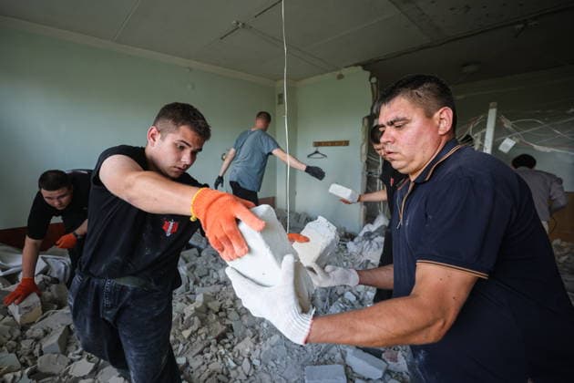 RUSSIA, DONETSK - AUGUST 5, 2026: Local residents clear the debris in a gastroenterology ward of Donetsk City Clinical Hospital No 7 following a Ukrainian drone strike. The attack left one patient dead and two others injured. Dmitry Yagodkin TASS  95820412