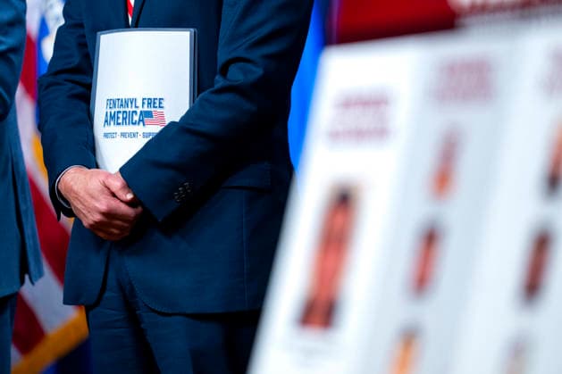 Drug Enforcement Administration (DEA) Administrator Terry Cole holds documents that say Fentanyl Free America during a press conference on the department s efforts to quell the Cartel Jalisco Nueva Generacion, or Jalisco New Generation Cartel (CJNG), a criminal group based in Mexico, at the Department of Justice headquarters in Washington, DC on Wednesday, August 5, 2026.  WAP20260805357 BONNIExCASH