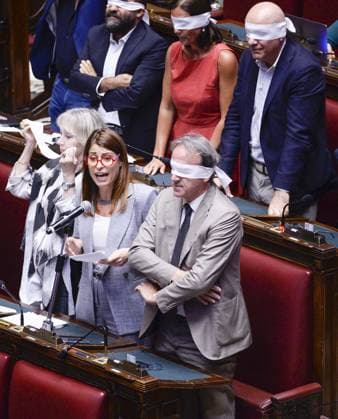 IPP Photo by Marco Mattei, Rome, August 5, 2026: Chamber of Deputies debate and vote on the authorization to seize Delmastro’s chat logs. Pictured: Elisabetta Piccolotti, with Angelo Bonelli beside her, and the AVS protest, with deputies covering their eyes with blindfolds. Italy Photo Press World Copyright