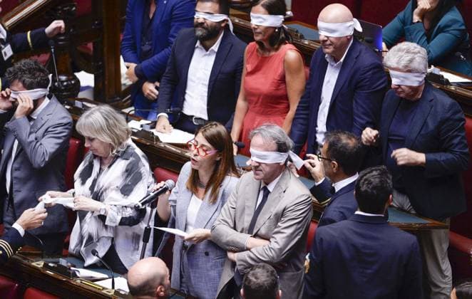 IPP Photo by Marco Mattei, Rome, August 5, 2026: Chamber of Deputies debate and vote on the authorization to seize Delmastro’s chat logs. Pictured: Elisabetta Piccolotti, with Angelo Bonelli beside her, and the AVS protest, with deputies covering their eyes with blindfolds. Italy Photo Press World Copyright