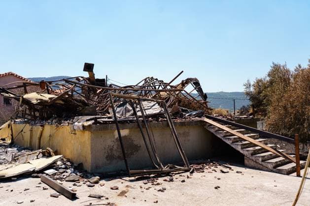 Residents return to wildfire-ravaged homes in western Attica PORTO GERMENO, WEST ATTICA, GREECE AUGUST 5, 2026: Extensive destruction caused by a major wildfire is seen in Porto Germeno, western Attica, four days after the fire swept through the area. More than 50 homes sustained damage ranging from partial destruction to complete collapse. Recovery and assessment operations continue as crews clear debris and inspection teams from Greece s General Secretariat for Natural Disaster Recovery evaluate damaged properties. Parts of the area remain without electricity and running water while restoration efforts continue. Porto Germeno Greece Copyright: x xRomanosxLioutasx xJNAxPressx