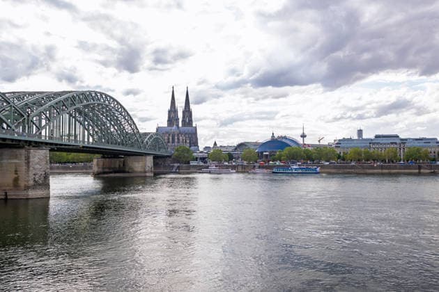 Cologne Skyline from Deutz: Cologne Cathedral, Hohenzollern Bridge, Musical Dome, and Colonius View from Cologne-Deutz of the Cologne skyline, featuring Cologne Cathedral, the historic Hohenzollern Bridge, the blue Musical Dome, and the 266-meter-tall Colonius telecommunications tower. In the foreground, the Bonn-based passenger ship MS Moby Dick is sailing on the R Copyright: xMarcxJohnx