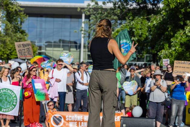 Fridays for Future Berlin Heat Protest, Germany, Berlin, August 6, 2026. Luisa Neubauer addresses the protesters from the stage in front of the Chancellery. In front of the Chancellery, climate activists are protesting under the slogan The Climate Crisis Is Escalating, Chancellor Remains