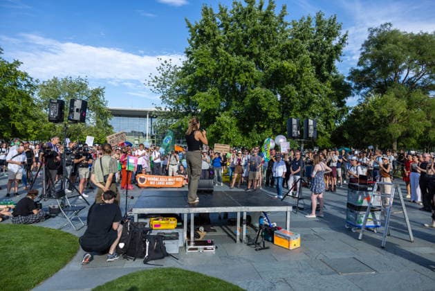 Fridays for Future Berlin Heat Protest, Germany, Berlin, August 6, 2026. Luisa Neubauer addresses the protesters from the stage in front of the Chancellery. In front of the Chancellery, climate activists are protesting under the slogan The Climate Crisis Is Escalating, Chancellor Remains