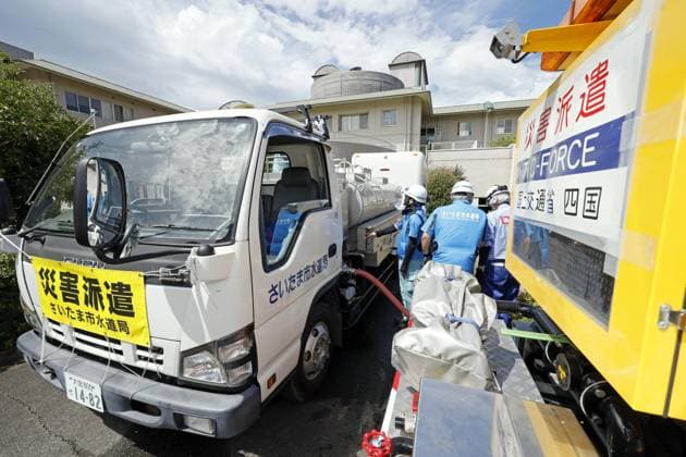 Aftermath of strong earthquake in Kumamoto Workers dispatched from the waterworks department of Saitama Prefecture in eastern Japan provide water to residents at a nursing home in Uto, Kumamoto Prefecture, on Aug. 7, 2026, after a powerful earthquake struck the southwestern Japan prefecture on July 28.  A14AA0005625326P