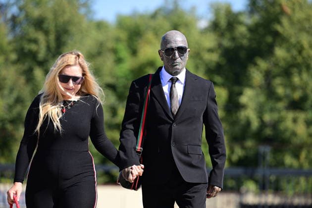 Last farewell to Czech artist Milan Knizak took place at the Strasnice Crematorium, in Prague, Czech Republic, on August 7, 2026. On the photo are seen, from left, photographer Ida Saudkova and artist Vladimir Franz. (CTKxPhoto MichalxKamaryt) CTKPhotoP2026080702928  CTKPhotoP2026080702928