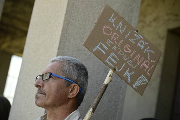 Last farewell to Czech artist Milan Knizak took place at the Strasnice Crematorium, in Prague, Czech Republic, on August 7, 2026. A man with banner which reads Knizak Original, not fake! (CTKxPhoto RomanxVondrous) CTKPhotoP2026080702981  CTKPhotoP2026080702981