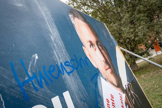 Damaged AfD campaign poster featuring lead candidate Ulrich Siegmund; campaign poster for the 2026 state election in Magdeburg, Saxony-Anhalt, Magdeburg, Saxony-Anhalt, Germany; downtown Magdeburg