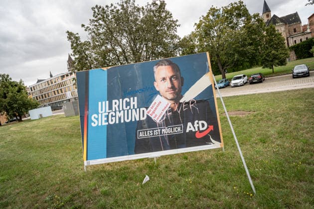 Damaged AfD campaign poster featuring lead candidate Ulrich Siegmund; poster for the 2026 state election in Magdeburg, Saxony-Anhalt, Magdeburg, Saxony-Anhalt, Germany; downtown Magdeburg