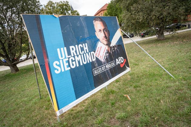 Damaged AfD campaign poster featuring lead candidate Ulrich Siegmund; poster for the 2026 state election in Magdeburg, Saxony-Anhalt, Magdeburg, Saxony-Anhalt, Germany; downtown Magdeburg