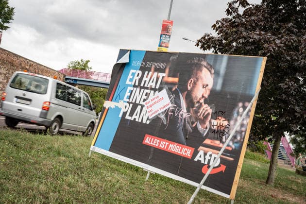 Damaged AfD campaign poster featuring lead candidate Ulrich Siegmund; poster for the 2026 state election in Magdeburg, Saxony-Anhalt, Magdeburg, Saxony-Anhalt, Germany; downtown Magdeburg
