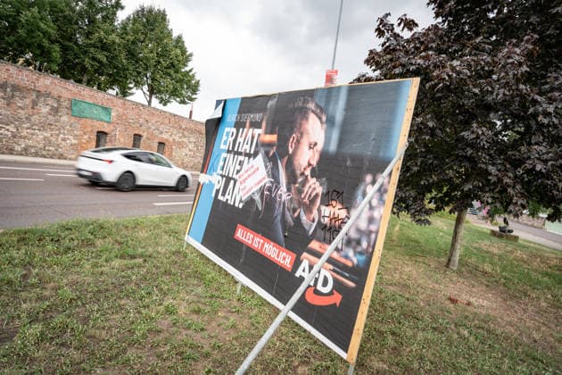 Damaged AfD campaign poster featuring lead candidate Ulrich Siegmund; poster for the 2026 state election in Magdeburg, Saxony-Anhalt, Magdeburg, Saxony-Anhalt, Germany; downtown Magdeburg