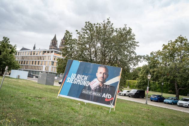 Damaged AfD campaign poster featuring lead candidate Ulrich Siegmund; poster for the 2026 state election in Magdeburg, Saxony-Anhalt, Magdeburg, Saxony-Anhalt, Germany; downtown Magdeburg