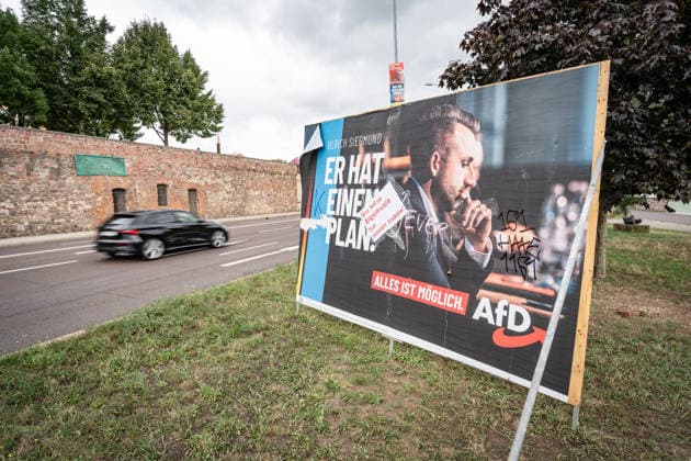 Damaged AfD campaign poster featuring lead candidate Ulrich Siegmund; poster for the 2026 state election in Magdeburg, Saxony-Anhalt, Magdeburg, Saxony-Anhalt, Germany; downtown Magdeburg