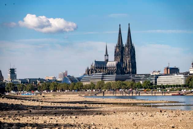 Low water levels in the Rhine near Cologne, View looking south from the right bank of the Rhine at Rheinpark; the city center with the cathedral; inland waterway shipping is severely restricted, with only a few ships operating, and those carrying greatly reduced loads; on the day this photo was taken, the Rhine water level in Cologne was the lowest ever recorded to date, at 60 cm, No