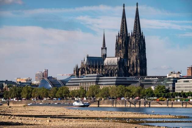 Low water levels in the Rhine near Cologne, View looking south from the right bank of the Rhine at Rheinpark; the city center with the cathedral; inland waterway shipping is severely restricted, with only a few ships operating, and those carrying greatly reduced loads; on the day this photo was taken, the Rhine water level in Cologne was the lowest ever recorded to date, at 60 cm, No