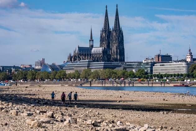 Low water levels in the Rhine near Cologne, View looking south from the right bank of the Rhine at Rheinpark; the city center with the cathedral; inland waterway shipping is severely restricted, with only a few ships operating, and those carrying greatly reduced loads; on the day this photo was taken, the Rhine water level in Cologne was the lowest ever recorded to date, at 60 cm, No