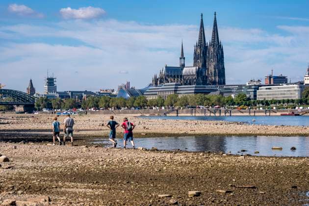 Low water levels in the Rhine near Cologne, View looking south from the right bank of the Rhine at Rheinpark; the city center with the cathedral; inland waterway shipping is severely restricted, with only a few ships operating, and those carrying greatly reduced loads; on the day this photo was taken, the Rhine water level in Cologne was the lowest ever recorded to date, at 60 cm, No