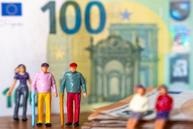 Bavaria, Germany August 7, 2026: Elderly people, symbolizing seniors and those in need of care, stand in front of euro banknotes. The image links the need for care in old age with care benefits, rising care costs, and the financing of care.