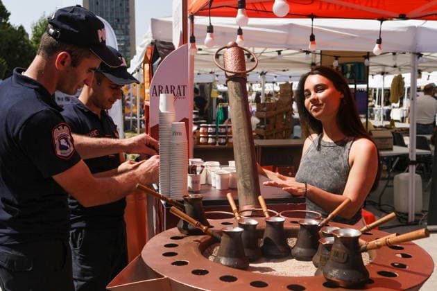 ARMENIA, YEREVAN - AUGUST 8, 2026: A woman serves coffee during the Siroooon Arm Fest festival celebrating the culture of Armenia in Seasons Park, central Yerevan. Alexander Patrin TASS  95906061