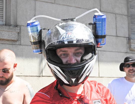 August 8, 2026, Switzerland, Zurich, Street Parade, Photo 33: Street Parade, raver wearing a motorcycle helmet and holding beer cans