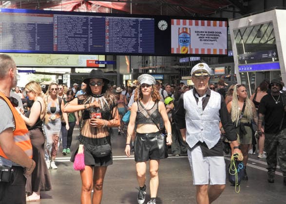 August 8, 2026, Zurich, Switzerland, 33rd Street Parade: Photo of a raver taking the train to the Street Parade