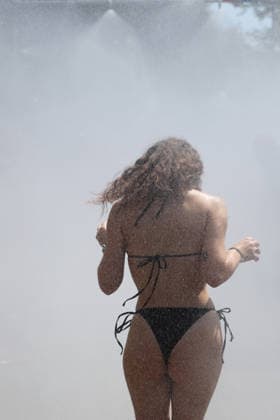August 8, 2026, Zurich, SWITZERLAND, 33rd Zurich Street Parade: A participant cools off