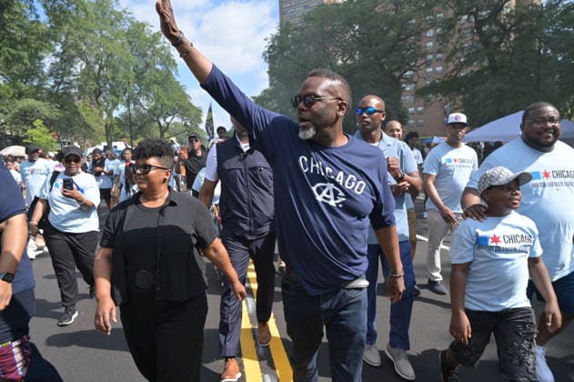 Chicago hosts 97th annual Bud Billiken Parade CHICAGO, ILLINOIS - AUGUST 8: Chicago Mayor Brandon Johnson (C) marches down Dr. Martin Luther King Jr. Drive alongside his wife Stacie Johnson (L) and supporters during the 97th annual Bud Billiken Parade in the Bronzeville neighborhood on August 8, 2026. Established in 1929, the historic procession is the largest African American parade in the United States, drawing hundreds of thousands of spectators to celebrate Black youth, culture, and the upcoming back-to-school season. Jacek Boczarski Anadolu Chicago United States. Editorial use only. Please get in touch for any other usage.  Copyright: x2026xAnadoluxJacekxBoczarskix