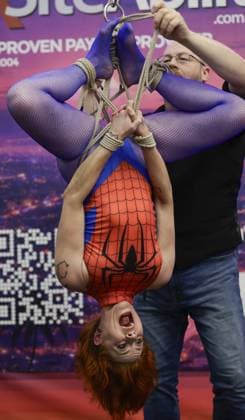 August 8, 2026, St. Petersburg, Florida, USA: Rigger Ben, puts the final knots on his ropes with model Zonah during a rigging demonstration at the Fetish Con trade show on Saturday, Aug. 8, 2026 in St. Petersburg. St. Petersburg USA - ZUMAs70_ 20260808_zan_s70_013 Copyright: xLuisxSantanax