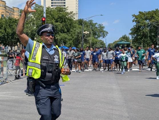 Chicago hosts 97th annual Bud Billiken Parade CHICAGO, ILLINOIS - AUGUST 8: A Chicago Police Department officer waves to spectators while walking down Dr. Martin Luther King Jr. Drive during the 97th annual Bud Billiken Parade in the Bronzeville neighborhood on August 8, 2026 in Chicago, Illinois. Established in 1929, the historic procession is the largest African American parade in the United States, drawing hundreds of thousands of spectators to celebrate Black youth, culture, and the upcoming back-to-school season. Jacek Boczarski Anadolu Chicago United States. Editorial use only. Please get in touch for any other usage.  Copyright: x2026xAnadoluxJacekxBoczarskix