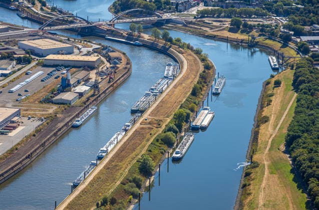 Aerial view, cargo ships docked at the exit of the Port of Duisburg, historic low water levels on the Rhine, Kaßlerfeld, Duisburg, Ruhr region, North Rhine-Westphalia, Germany ATTENTION: MINIMUM FEE: 60 EUR